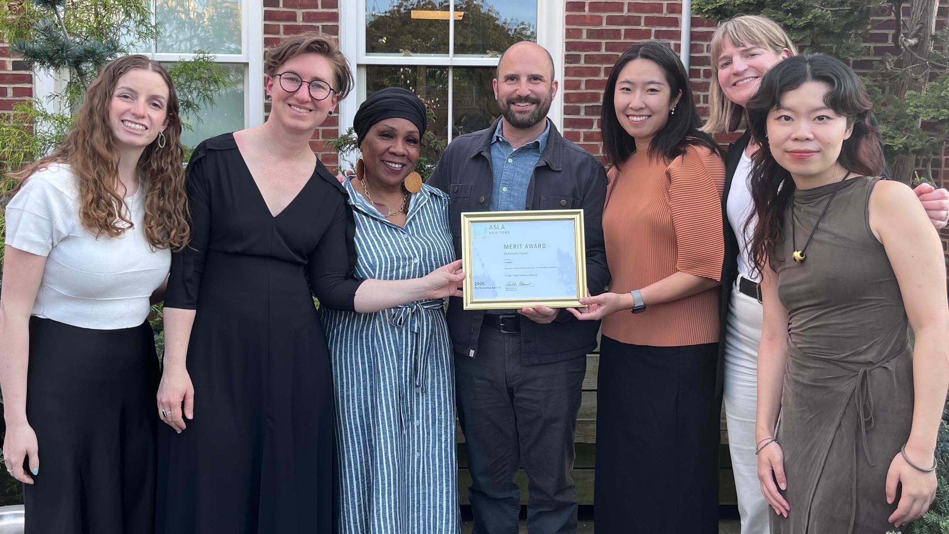 Picture of members of project team with award
